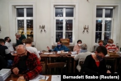 Volunteers fold NTI newsletters.