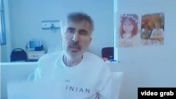 Georgian former President Mikheil Saakashvili joins his trial via video link from prison on February 1.