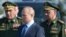 Russian General Valery Gerasimov (left), President Vladimir Putin (center), and ex-Defense Minister Sergei Shoigu (file photo) 