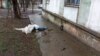 A Ukrainian civilian lies dead on the streets of Mariupol during Russia's brutal siege of the city last year. 
