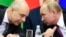 Russian Finance Minister and Security Council member Anton Siluanov (left), pictured speaking with President Vladimir Putin, is one of the people emphasized on the list. 