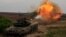 Украинские танкисты ВСУ ведут огонь с закрытых позиций в Донецкой области по российской армии, 12 августа 2022 года