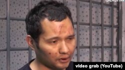 Бети-башы көгала болгон Викрам Рузахунов Алматыдагы башаламандыктарга катышы бар экенин айтып жаткан видеодон скриншот.