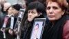 Родственники жертв 1 марта 2008 года с портретами погибших во время митинга оппозиции. 