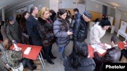 Armenia - Residents of Yerevan queue up at a polling station to vote in a presidential election, 18Feb2013.