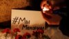 Supporters light candles in St. Petersburg in December after Russia's Supreme Court ruled that Memorial International must be liquidated for breaking the onerous "foreign agent" law. This card shows a hashtag saying: "We Are Memorial."