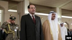 نوری المالکی همراه با نخست وزیر کویت در جریان سفرش به کویت.(عکس از epa)