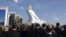 People attend the inauguration of a gilded equestrian statue of Turkmen President Gurbanguly Berdymukhammedov in Ashgabat in May 2015. 