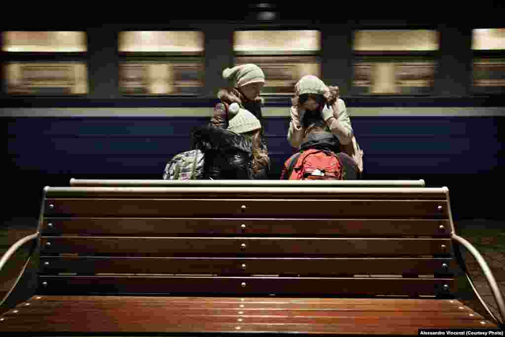 Second-year students wait for their train early in the morning.