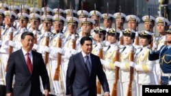 Hytaý Halk Respublikasynyň başlygy Şi Jinpin we Türkmenistanyň prezidenti Gurbanguly Berdimuhamedow. Pekin, 12-nji maý, 2014.