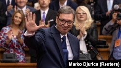 Serbian President Aleksandar Vucic acknowledges the applause during the swearing-in ceremony for a second term in parliament in Belgrade on May 31.