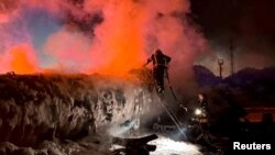 Members of emergency services work in the aftermath of a Russian drone strike in Izmayil, Ukraine on July 24.
