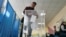 A Kazakh voter casts his ballot in Astana during the October 6 referendum. 