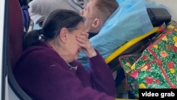 Civilians wait to leave Kostyantynivka with help from the Proliska humanitarian mission.