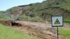 Armenia -- A warning sign at a toxic waste burial site near Yerevan.