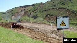 Armenia -- A warning sign at a toxic waste burial site near Yerevan.