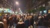 People in Belgrade on November 9 gather in support of Aida Corovic and Jelena Jacimovic, who were arrested for throwing eggs at a mural of Ratko Mladic.