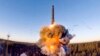 A rocket launches from a missile system as part of a ground-based intercontinental ballistic missile test launched from the Plesetsk facility in northwestern Russia in December 2020.