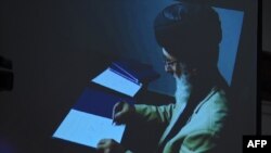 Gulbuddin Hekmatyar was seen signing the peace accord with Kabul on a video link that was broadcast live on TV. 