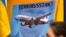 Плакат учасників акції протесту в столиці Австралії через два дні після збитого 17 липня російськими гібридними силами на Донбасі «Боїнга», в результаті чого загинули 298 людей. Сідней, 19 липня 2014 року