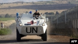 Ілюстраційне фото. Транспорт миротворчої місії ООН проходить вздовж ізраїльського кордону з Сирією, червень 2013 року