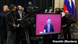 Голова КНР Сі Цзіньпін виступає на церемонії запуску газопроводу «Сила Сибіру», телеміст із Сочі, Росія, 2 грудня 2019 року