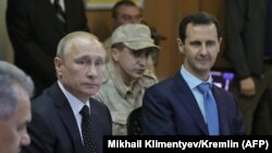 Президенттер Путин жана Асад Сириянын Хмеймим аскер базасында жолукканда. 11-декабрь, 2017-жыл. 