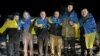 Ukrainian POWs pose after a prisoner swap at an unknown location in Ukraine on January 3. 