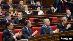 Armenia - Vahram Baghdasarian (L) and other deputies from the ruling Republican Party applaud during a parliament session, Yerevan, 21Apr2015.