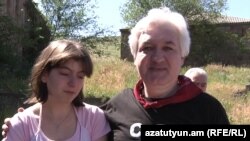 Armenia - Opposition activist Sarkis Hatspanian is pictured with his daughter after being released from Yerevan's Vartashen prison, 9June2011.