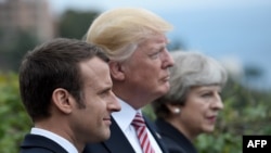 Президент Франції Емманюель Макрон, президент США Дональд Трамп і прем’єр-міністр Великобританії Тереза Мей (зліва направо) на саміті G7 на Сицилії 26 травня