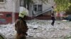 Emergency personnel work at the site of a strike in Zaporizhzhya on October 1.