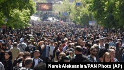 ARMENIA -- Opposition demonstrators throng in a tree lined avenue during a rally to protest the former president's shift into the prime minister's seat in Yerevan, April 17, 2018