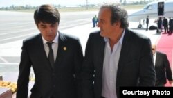 Рустам Эмомали УЕФА президенти Мишел Платини менен 10-октябрь, 2012-жыл