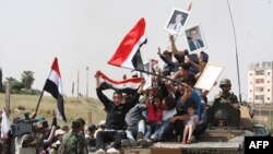 Сырыя: прыхільнікі прэзыдэнта Сырыі Башара Асада сьвяткуюць у горадзе Дэраа пасьля яго "зачысткі" ўрадавымі войскамі