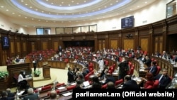 Lawmakers in session in the parliament in Yerevan on March 24