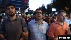 Armenia - Opposition leaders Andrias Ghukasian (C), Armen Martirosian (R) and Davit Sanasarian lead an anti-government march in Yerevan, 29Jul2016.