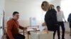 Armenia - A voter in Yerevan casts a ballot in a constitutional referendum, 6Dec2015.