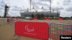 U.K. -- Paralympic Games signs are seen in front of the Olympic Stadium in the Olympic Park at Stratford, east London, 22Aug2012