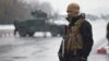 An Afghan soldier guards the site of an attack near the Marshal Fahim Military Academy in Kabul on January 29.