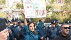 Armenia -- A protester holds a poster during a demontration outside the Armenian parliament against the ratification of the Istanbul Convention, Yerevan, November 1, 2019.