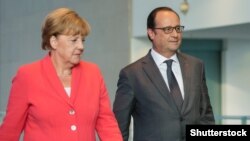 Анґела Меркель і Франсуа Олланд