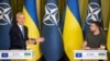 NATO Secretary General Jens Stoltenberg (left) and Ukrainian President Volodymyr Zelenskiy attend a press conference in Kyiv on September 28.