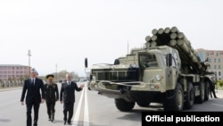Azerbaijan - President Ilham Aliyev (L) inspects a Russian-made Smerch multiple-launch rocket system deployed in Nakhichevan, 7Apr2014.