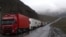 Georgia - Armenian and other heavy trucks are lined up on a road leading to the Georgian-Russian border crossing at Upper Lars, 6May2016.