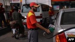 Finance Minister Ishaq Dar said he hoped the announcement would dispel speculation on social media of a higher price hike or that gasoline supplies would run dry. (file photo)