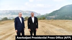 Turkish President Tayyip Erdogan (L) meets with Azerbaijani President Ilham Aliyev in Nagorno-Karabakh, June 15, 2021