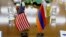 Armenia - U.S. and Armenian national flags placed on a negotiating table in Yerevan, 18Dec2013.