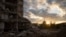 The sun sets over a destroyed building in Izyum in Ukraine's Kharkiv region on October 24.