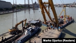 The Mermaid, which sank in the Danube in 2019, is lifted from the river as part of a salvage operation. (file photo)